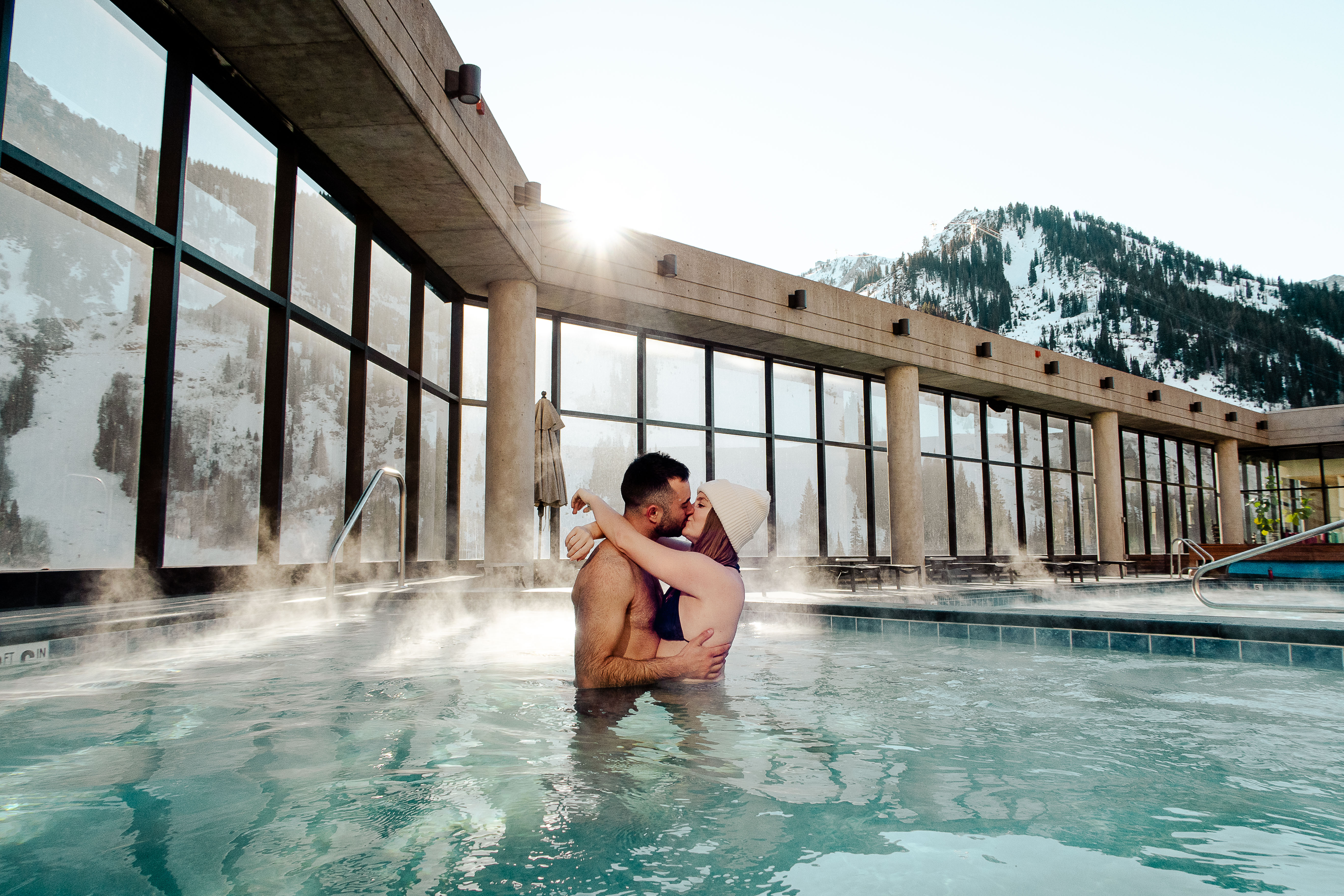 couple in the hot tub on the roof top in the cliff spa at the cliff lodge in snowbird utah which is near salt lake city
